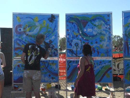 Members of BAM painting to the music